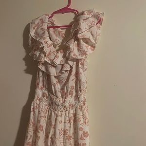 This is a dress with off shoulder. This dress is white with pink flowers.